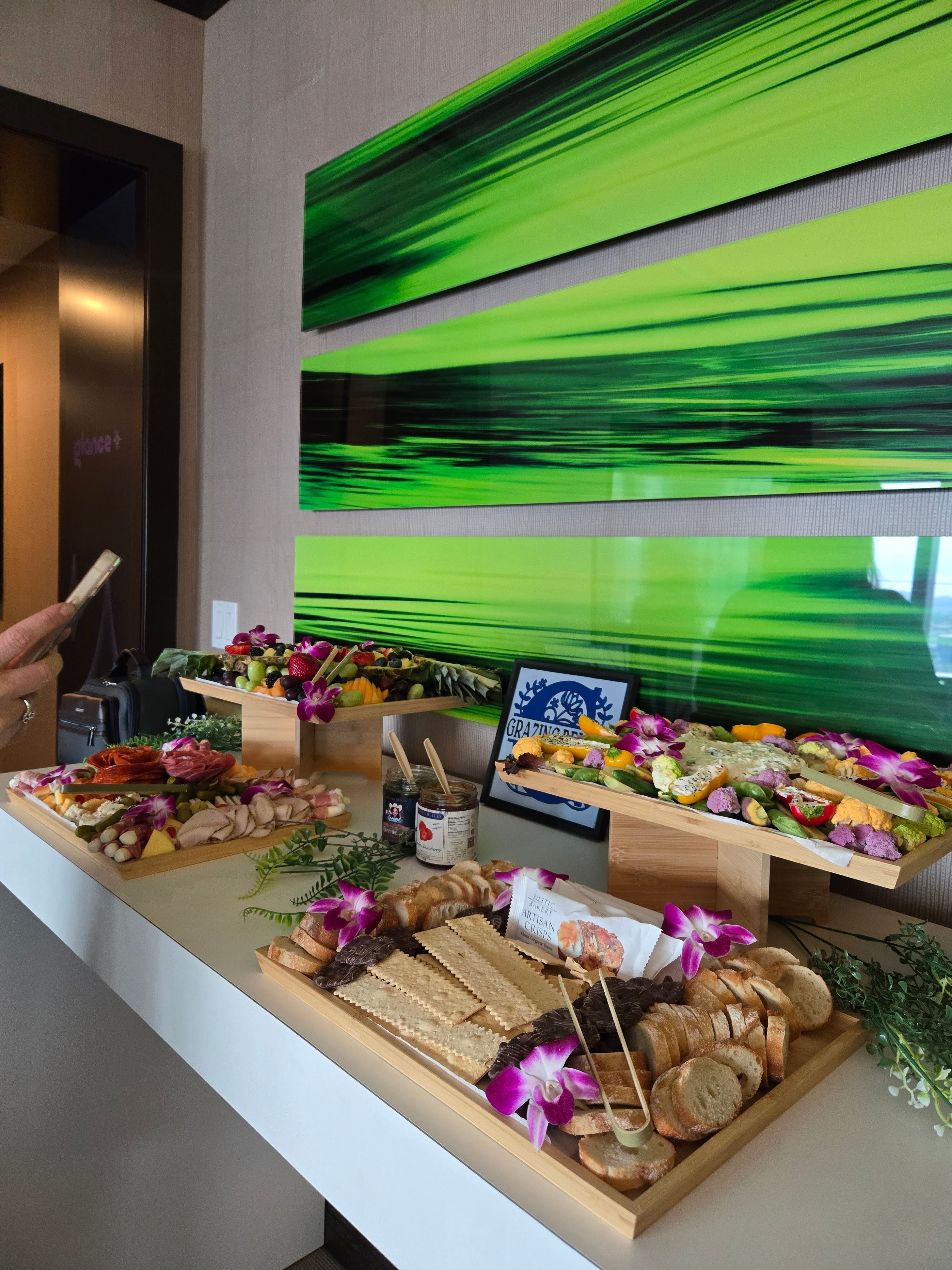 Handcrafted charcuterie grazing boards with cheese, meats, and fruit for event catering.