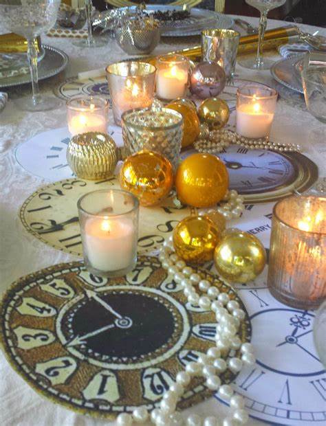 Elegant event table decor with gold ornaments, tea light candles, and pearl accents.